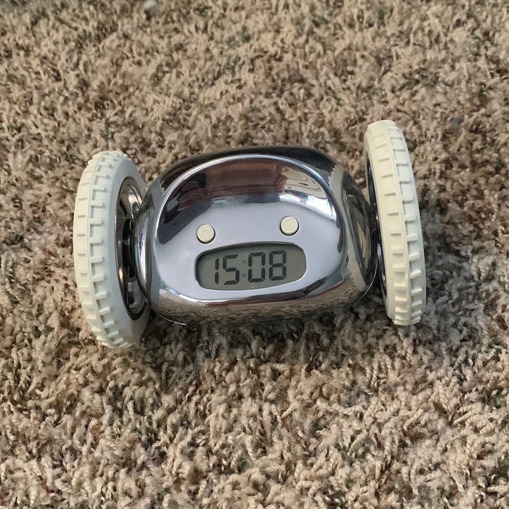Alarm clock on wheels